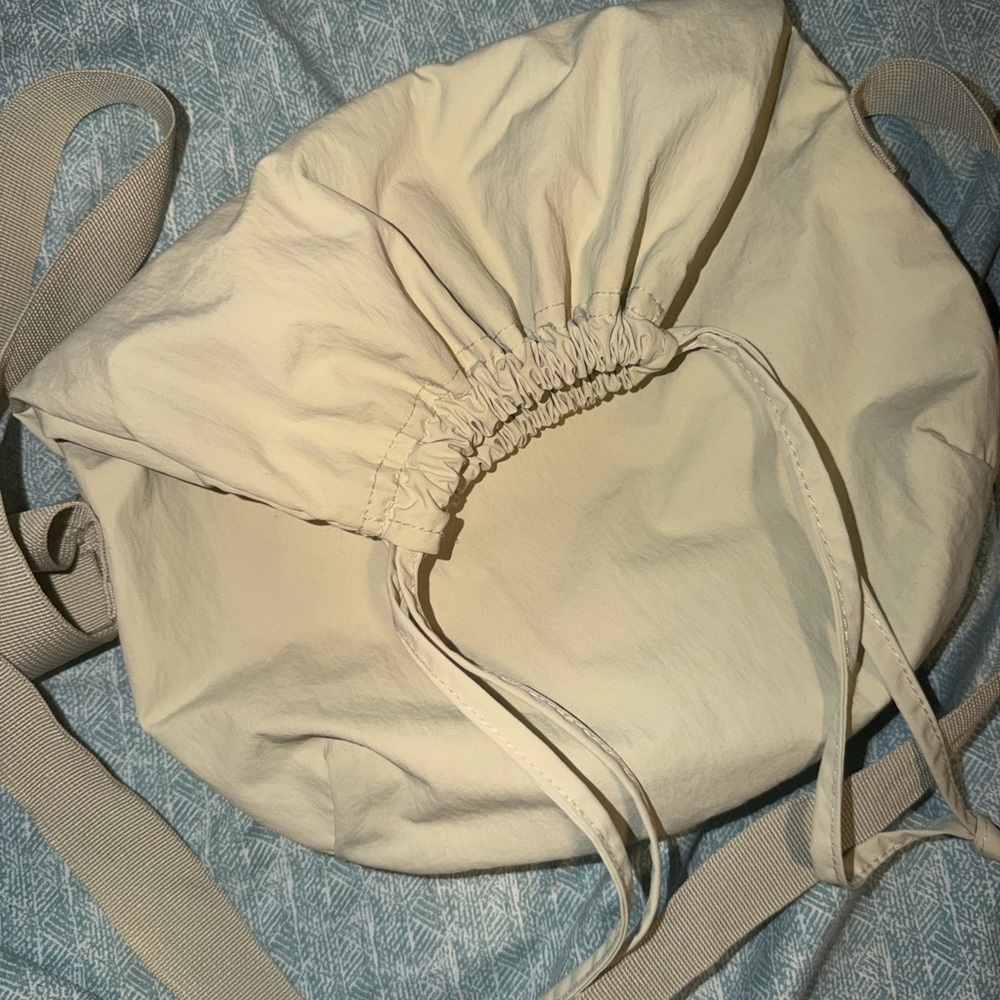 UNIQLO Cream Drawstring Crossbody